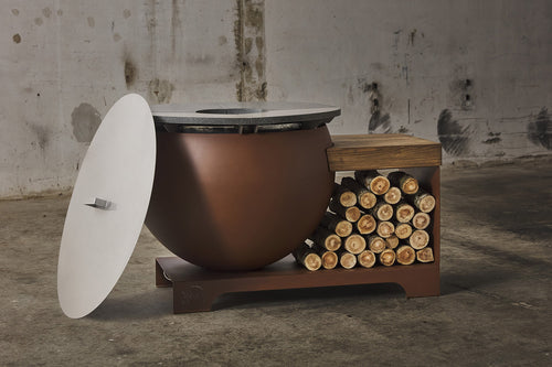 Barbecue a legna Binari BELL.O in corten, con design moderno e superficie in acciaio per cottura all'aperto