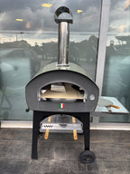 Forno a legna e gas Dielle Stufe per patio, in acciaio con porta in vetro e doppia camera di combustione.