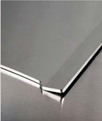 Piastra in acciaio inox Fògher, accessorio per barbecue, con superficie liscia per cucinare carne e verdure.