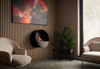 Stufa a bioetanolo Planika Bubble con design elegante e moderna, visibile con pareti di vetro e fiamma visibile.