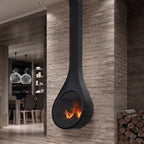 Camino a legna Rocal Drop con design moderno, in mattoni e vetro frontale, ideale per riscaldare e decorare gli ambienti domestici